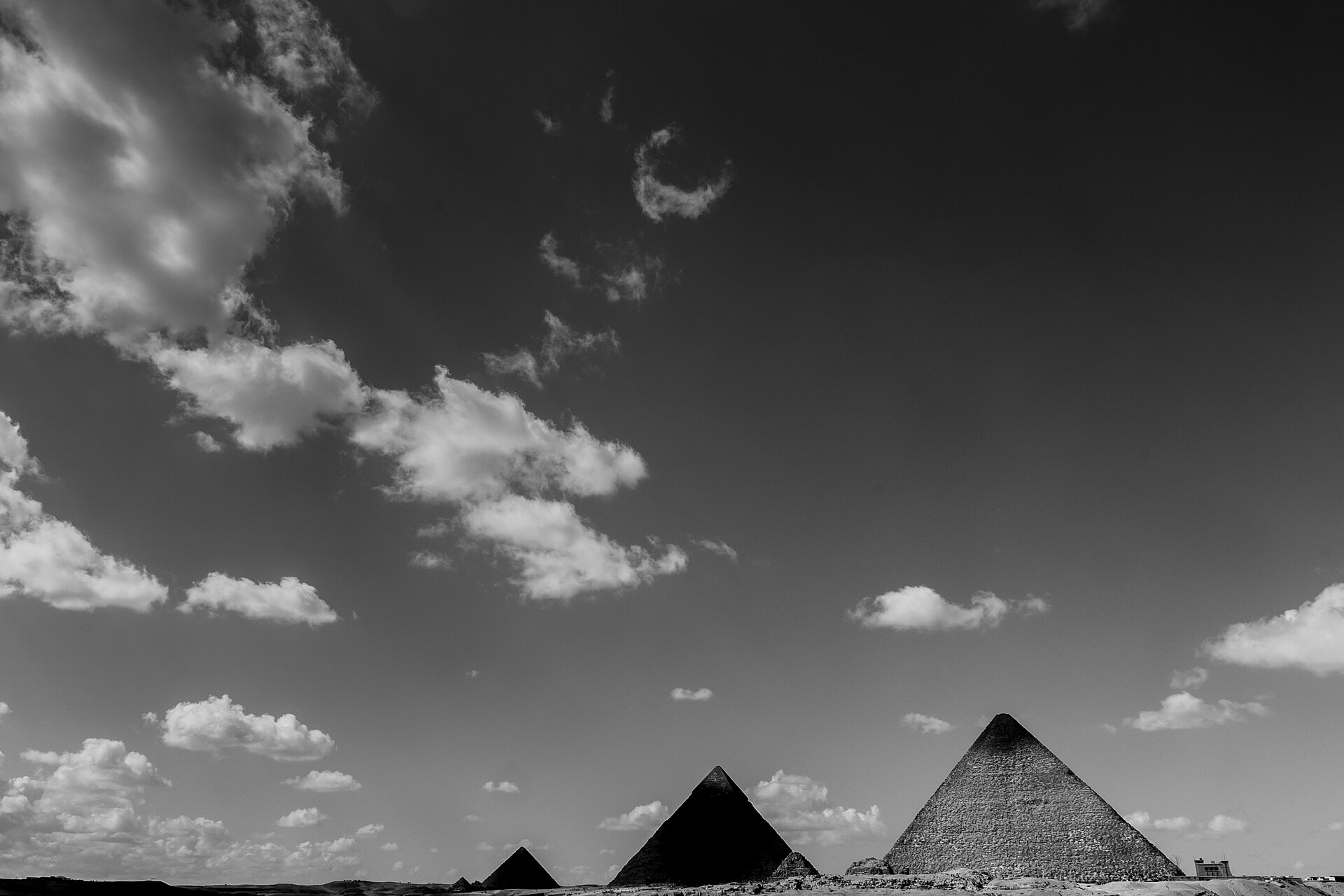The three pyramids of Giza in alignment against the desert
